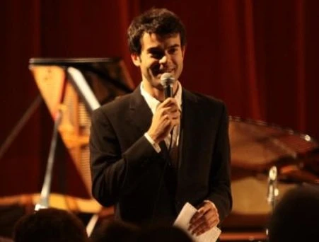 Alin Gherman speaking at microphone, Mons